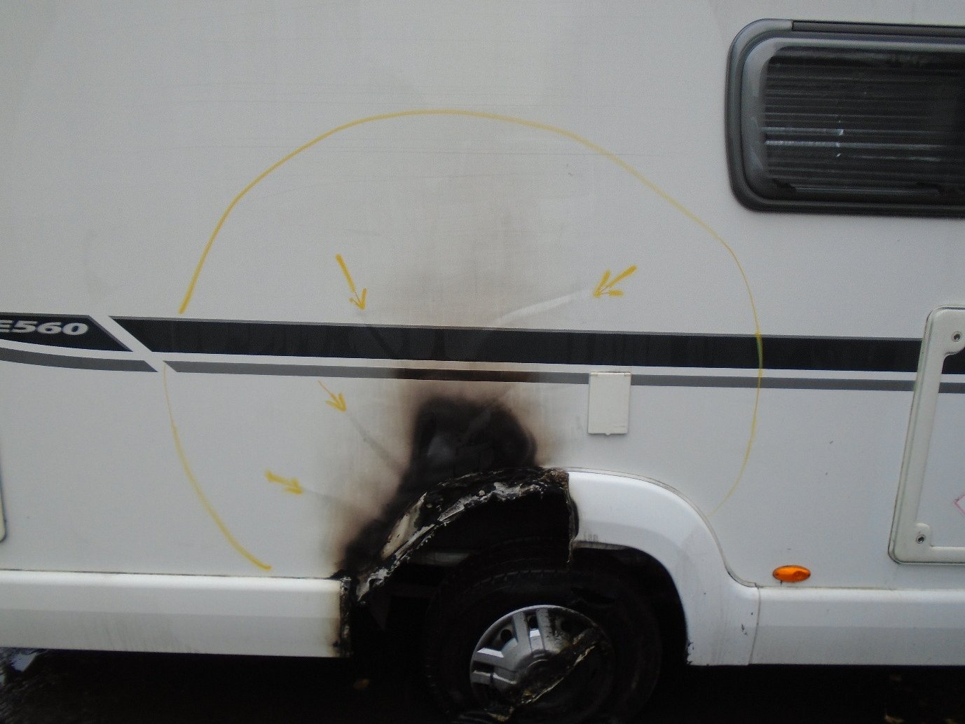Caravan wheel arch with fire damage