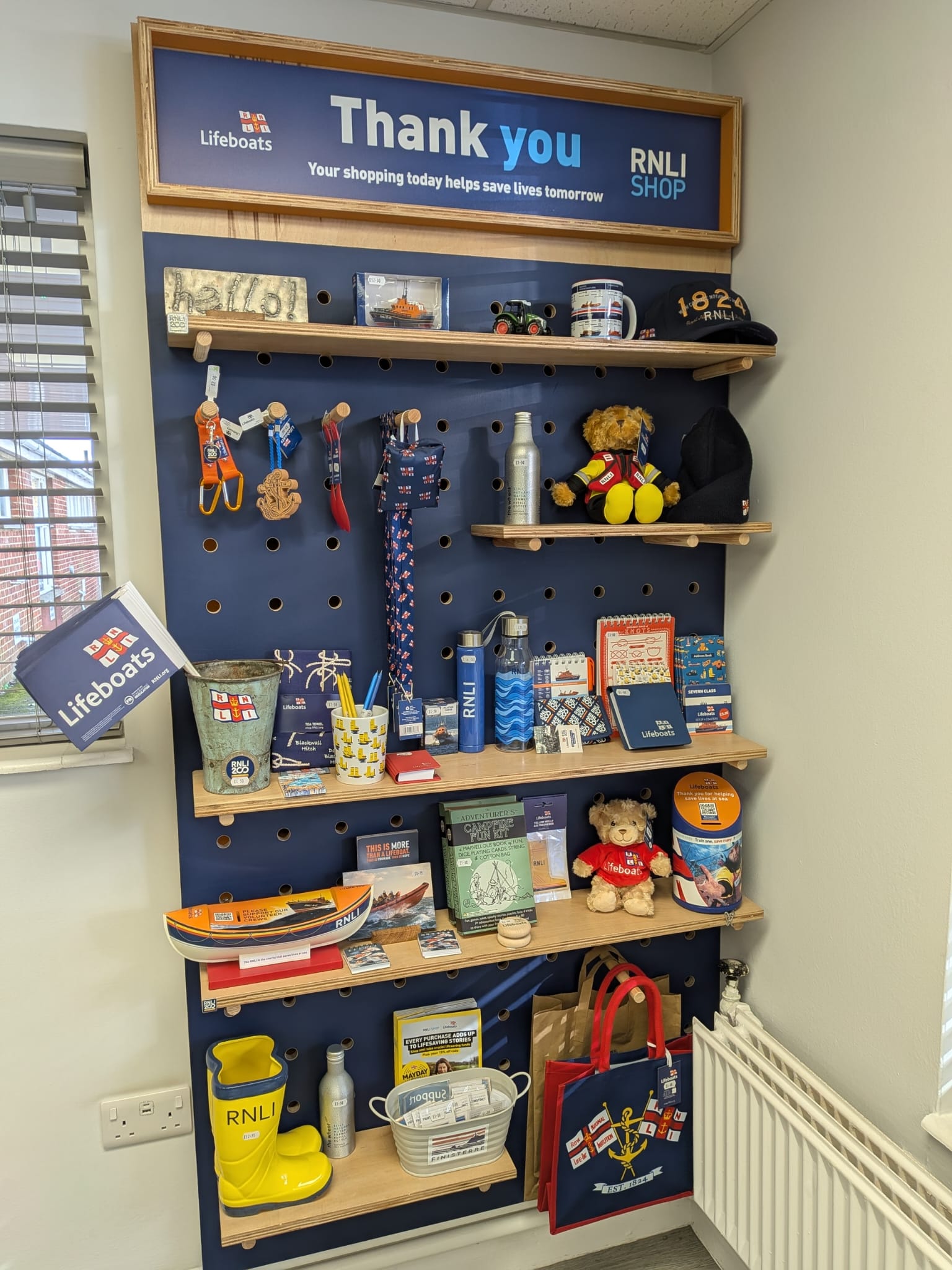 RNLI charity shop display in our reception